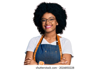 Young african american woman dressmaker designer wearing atelier apron smiling with a happy and cool smile on face. showing teeth.  - Powered by Shutterstock