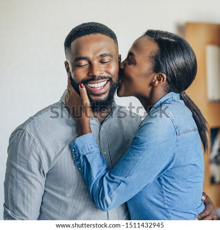 Similar – Image, Stock Photo Woman kissing man from side in sunset