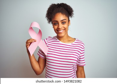 Young African American Woman Holding Cancer Ribbon Over Isolated White Background With A Happy Face Standing And Smiling With A Confident Smile Showing Teeth