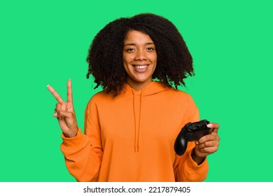 Young African American Woman Holding A Game Controller Isolated Showing Number Two With Fingers.