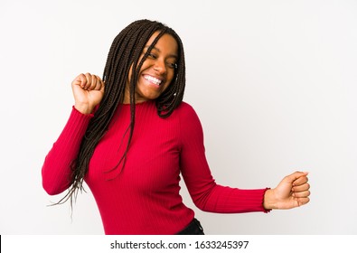 Young african american woman isolated dancing and having fun.