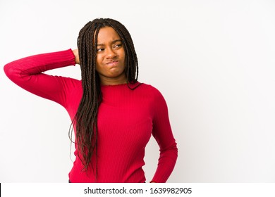 Young african american woman isolated touching back of head, thinking and making a choice.