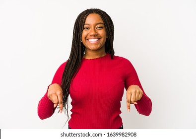 Young african american woman isolated points down with fingers, positive feeling.