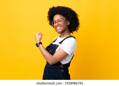 Young African American Woman Isolated On Yellow Background Celebrating A Victory