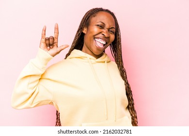 Young African American Woman Isolated On Pink Background Showing A Horns Gesture As A Revolution Concept.