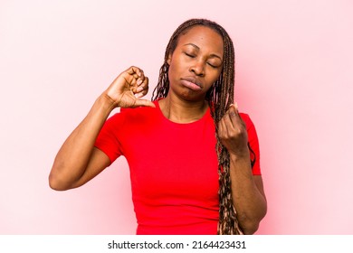 Young African American Woman Isolated On Pink Background Showing That She Has No Money.