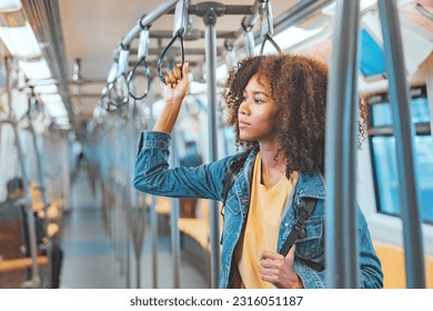 Young African American woman passenger taking the train, lifestyle, transportation. - Powered by Shutterstock