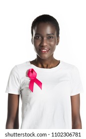 Young African American Woman With Pink Ribbon On T-shirt Smiling At Camera Isolated On White, Breast Cancer Concept