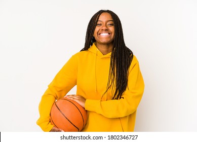 Young African American Woman Playing Basketball Isolated Laughing And Having Fun.