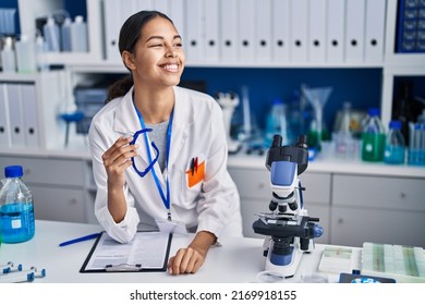 Young African American Woman Scientist Smiling Confident At Laboratory