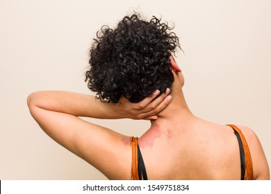 Young African American Woman With Skin Birth Mark Smiling Happy And Confident, Touching Chin With Hand.