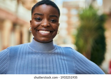 Young African American Woman Smiling Happy Standing At The City.