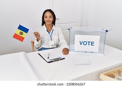 Young African American Woman Smiling Confident Holding Moldova Flag Working At Electoral College