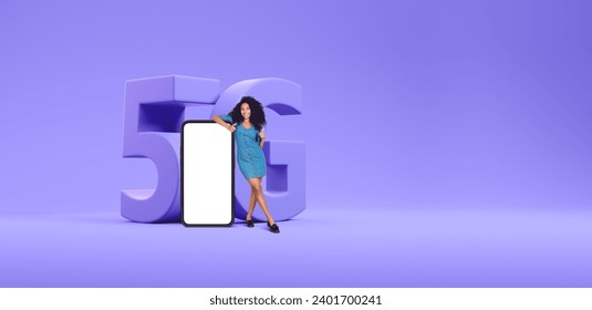 Young African American woman standing near big smartphone with mock up display and 5G sign. Concept of telecommunication and internet connection