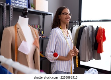Young african american woman tailor smiling confident standing at atelier - Shutterstock ID 2256896513