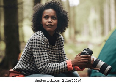 Young African American Woman Taking Photos With A Telephoto Lens While Camping In The Woods 