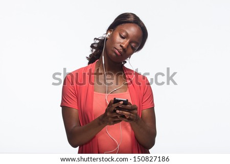 Young African American woman using iPod, horizontal