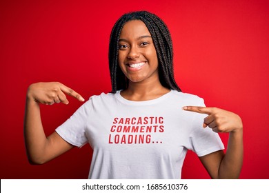 Young African American Woman Wearing Sarcasm Coments Text On T-shirt Over Red Background Very Happy Pointing With Hand And Finger