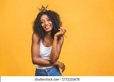 Young African American Woman Wearing Golden Crown Of Queen Over Isolated Over Yellow Background With A Happy And Cool Smile On Face. Lucky Person.