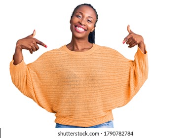 Young african american woman wearing casual clothes looking confident with smile on face, pointing oneself with fingers proud and happy. 
