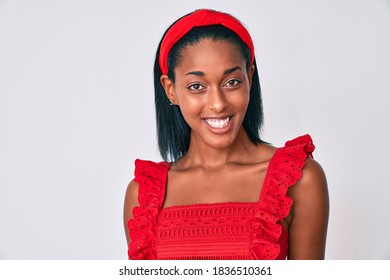Young african american woman wearing casual clothes looking positive and happy standing and smiling with a confident smile showing teeth  - Shutterstock ID 1836510361