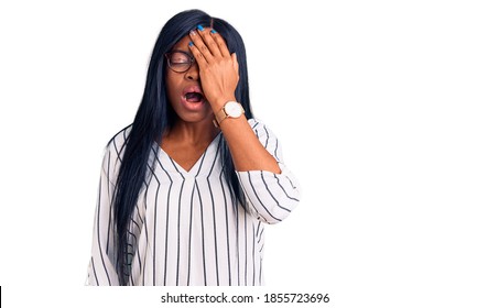 Young african american woman wearing casual clothes and glasses yawning tired covering half face, eye and mouth with hand. face hurts in pain.  - Powered by Shutterstock