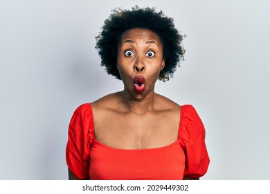 Young African American Woman Wearing Casual Clothes Afraid And Shocked With Surprise Expression, Fear And Excited Face. 