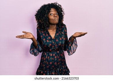 Young African American Woman Wearing Casual Clothes Clueless And Confused With Open Arms, No Idea And Doubtful Face. 