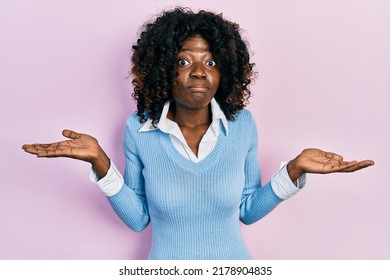 Young African American Woman Wearing Casual Clothes Clueless And Confused With Open Arms, No Idea And Doubtful Face. 