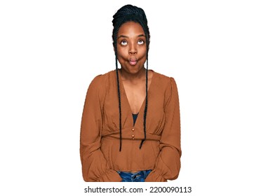 Young African American Woman Wearing Casual Clothes Making Fish Face With Lips, Crazy And Comical Gesture. Funny Expression. 