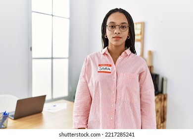 Young African American Woman Wearing Hello My Name Is Sticker Identification Thinking Attitude And Sober Expression Looking Self Confident 