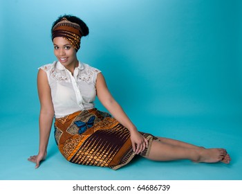 Young African American Woman Wearing Head Wrap And Skirt