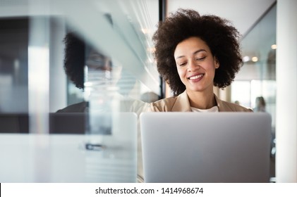 Young african american woman working with tablet in office