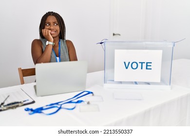 Young African American Woman Working At Political Election Sitting By Ballot Looking Stressed And Nervous With Hands On Mouth Biting Nails. Anxiety Problem. 
