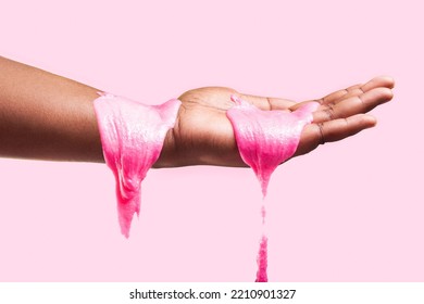 Young African American Woman's Hand Dripping With Pink Body Scrub, Sugar Scrub For Showering Body Polish