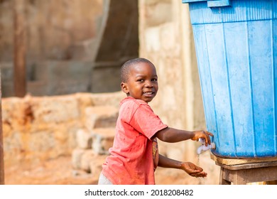 young african black boy Washing Hands for a local tap