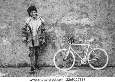 Similar – Image, Stock Photo Young man with bicycle in the sea