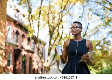 Young African Business Woman Walking Down The Street