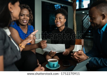 Similar – Image, Stock Photo Young black businessman in suit standing on stairs