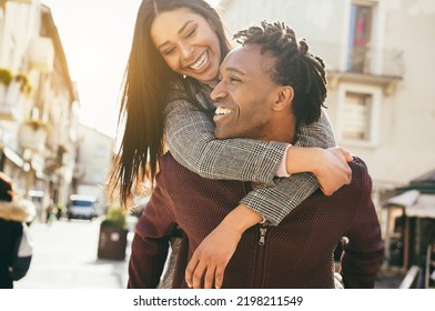 Young african couple having fun walking around the city - Main focus on man mouth - Shutterstock ID 2198211549