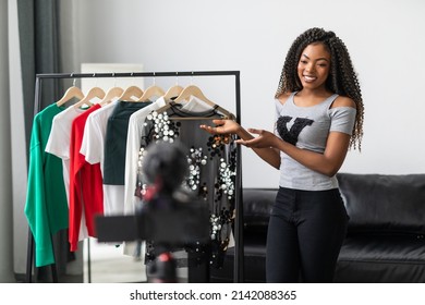 Young African Fashion Stylist Showing Her Wardrobe Record On Camera