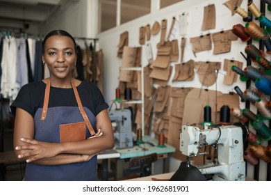 Young African female leather worker standing in her studio - Shutterstock ID 1962681901