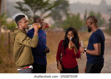 Young African Friends Having Drinks At A Get Together