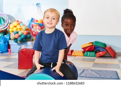 Young and African girl in the gym in multicultural kindergarten