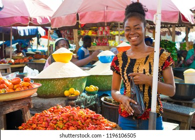A Young African Girl In A Local African Market 