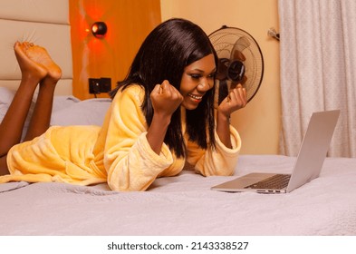 Young African Introvert Woman Using Her Laptop In Bed