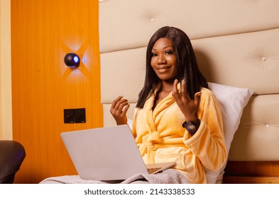 Young African Introvert Woman Using Her Laptop In Bed