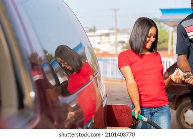 Young African Lady Working As A Petrol Station Attendant