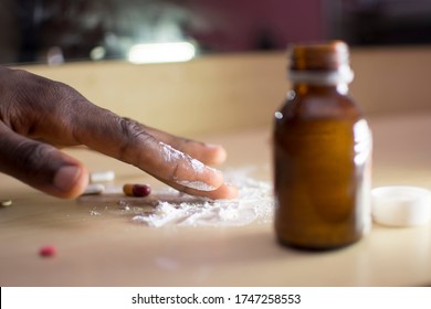 A Young African Man Mixing Harmful Substance, Drug Abuse.