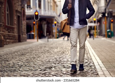 Young African Man On Vacation Exploring European City Cobblestone Street